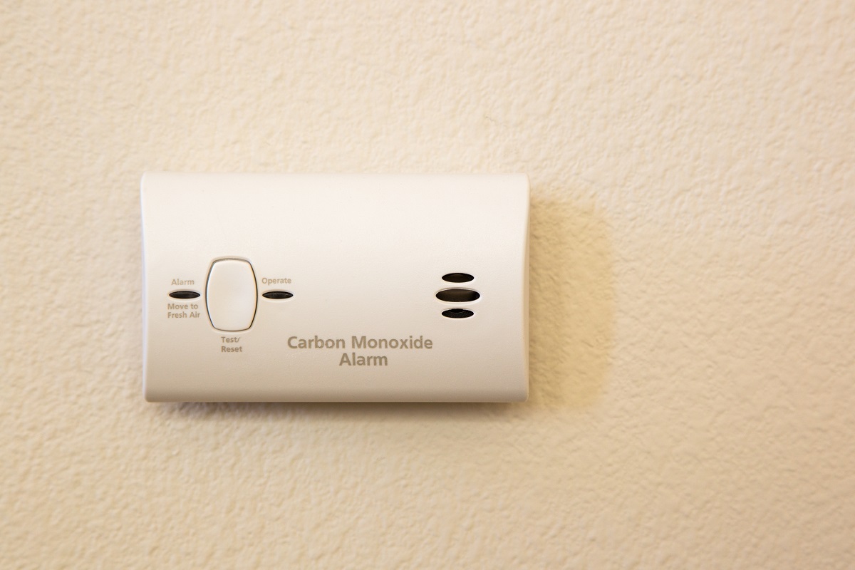 a CO alarm hanging on the wall