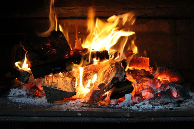 a log burning in a fireplace