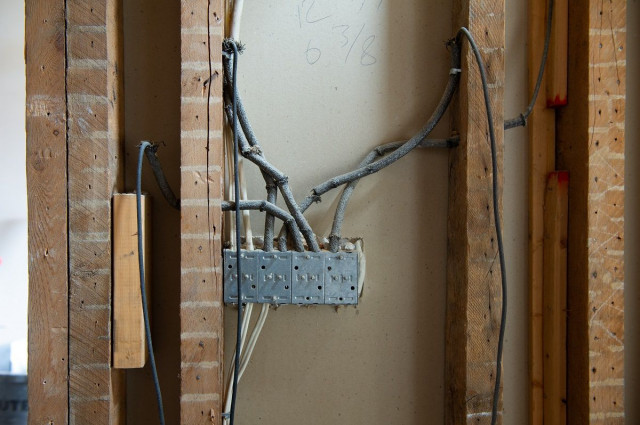 knob and tube wiring in a wall frame of a home