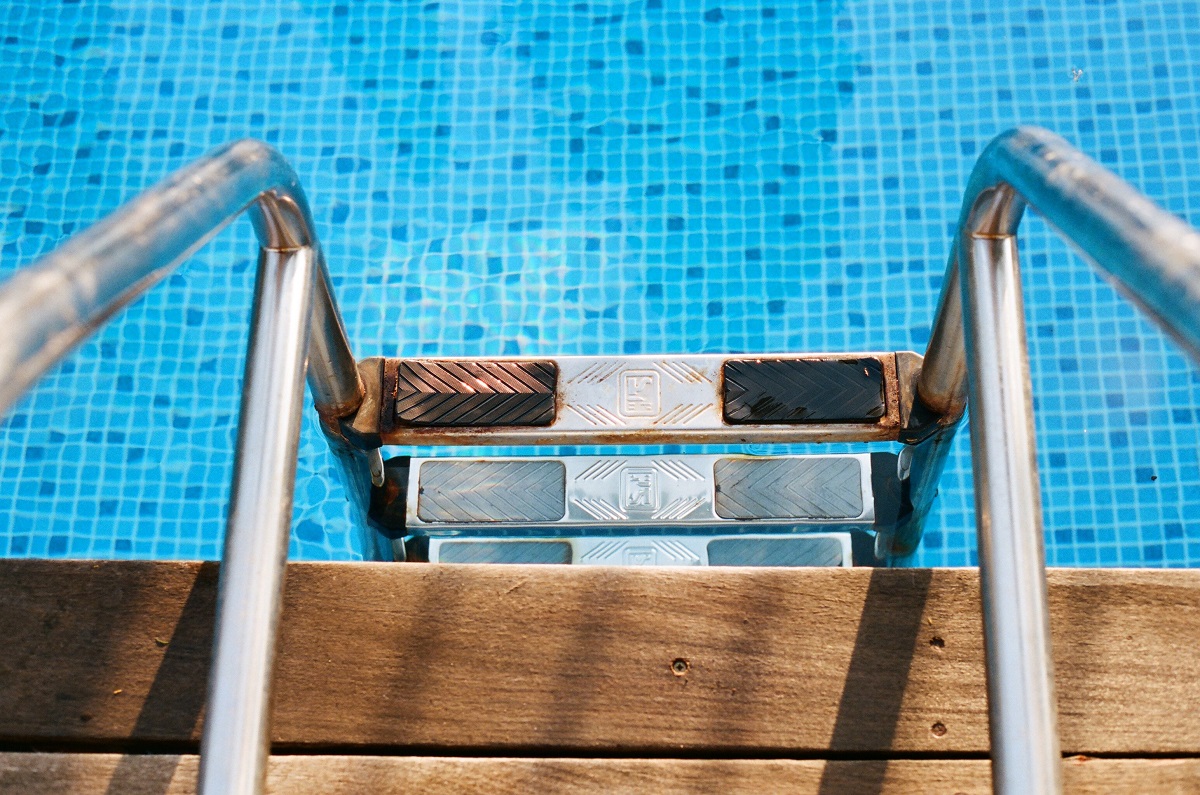 a pool ladder descending into a pool