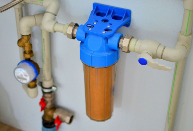 a water filtration system on the main water supply line into a home