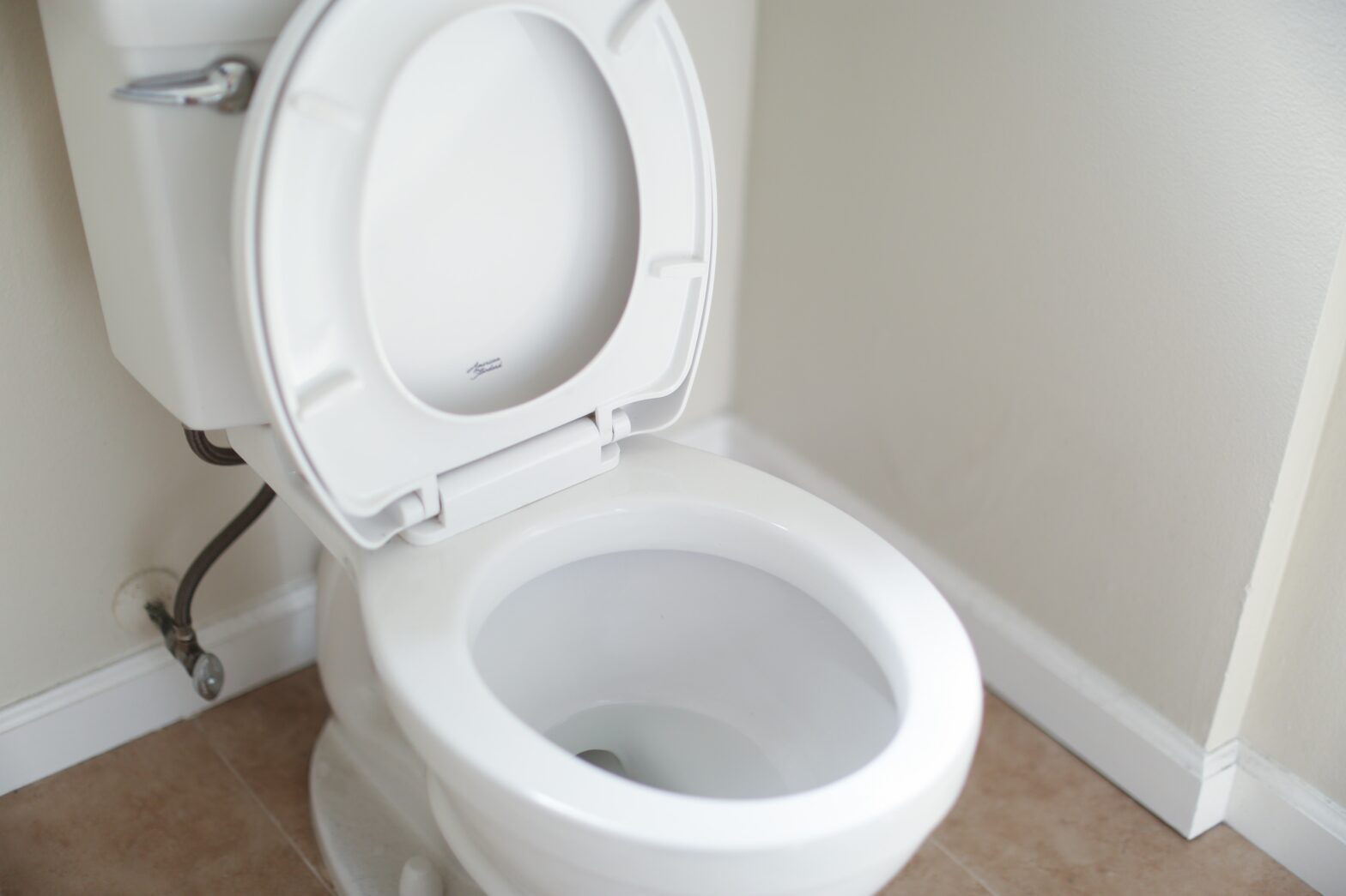 toilet with its seat up
