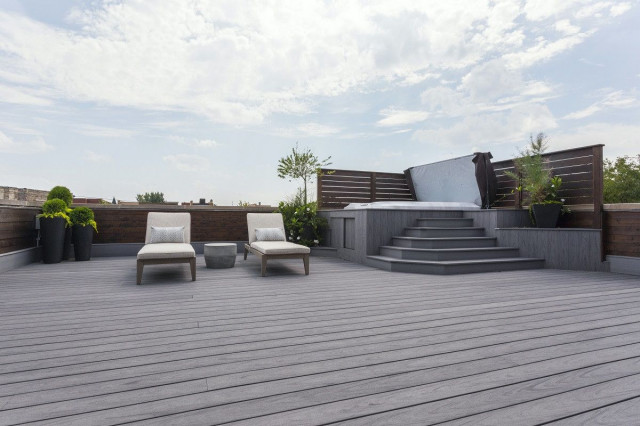 patio with lounges and hot tub