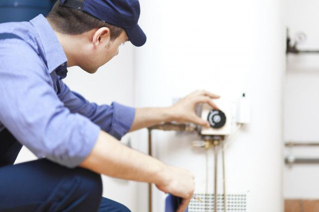 professional adjusting water heater