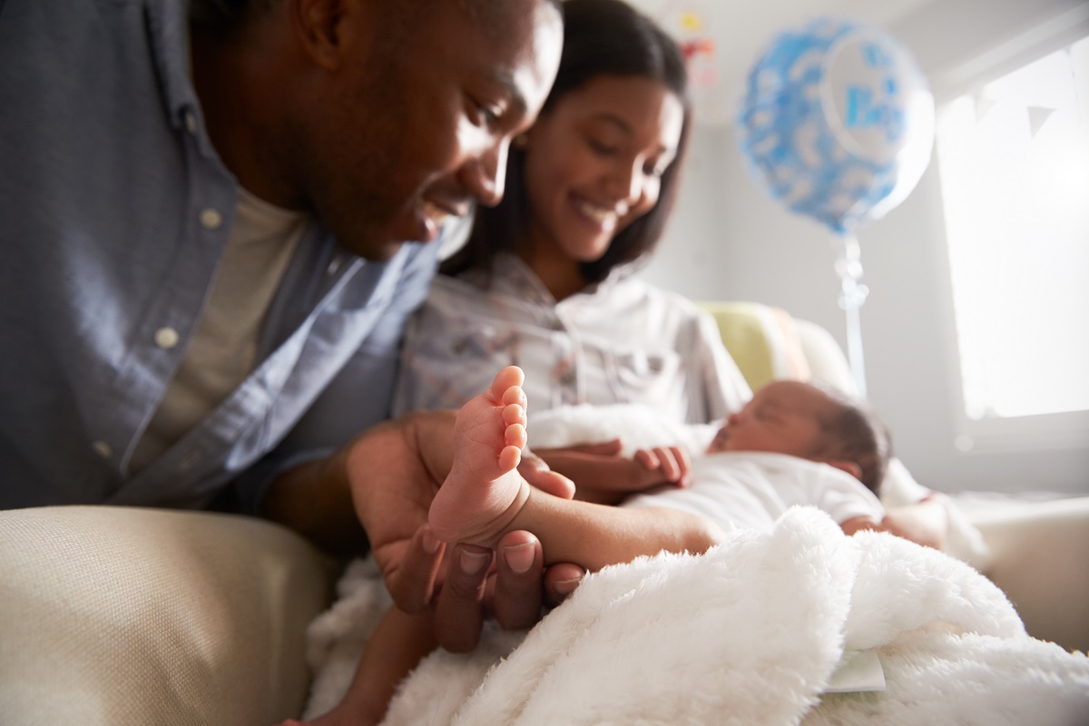 a new mom and dad at home with their newborn boy