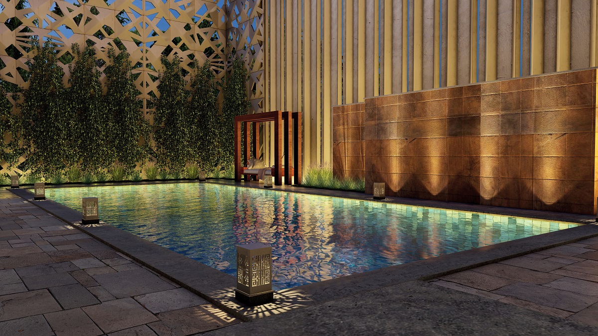 a pool at dusk with its lights illuminated