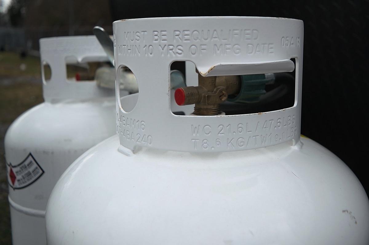 Two propane tanks outside next to one another