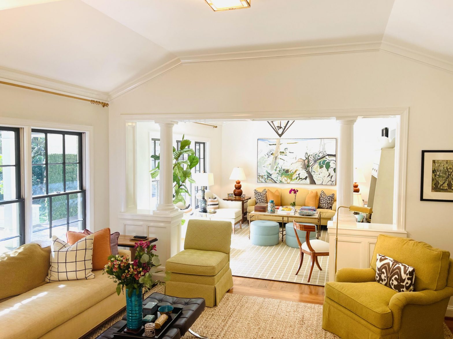 an elegant living room with a separate sitting area