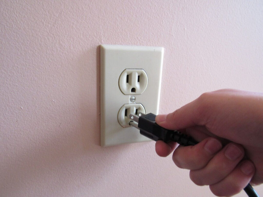 plugging into a three-pronged outlet
