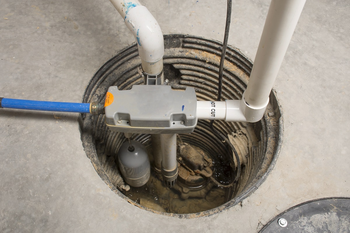a sump pump in a basement floor