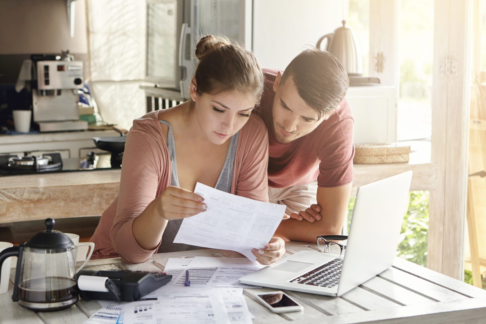 a couple looking over paperwork