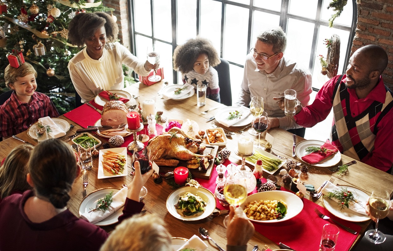 large family gathered around the dining table at Christmas