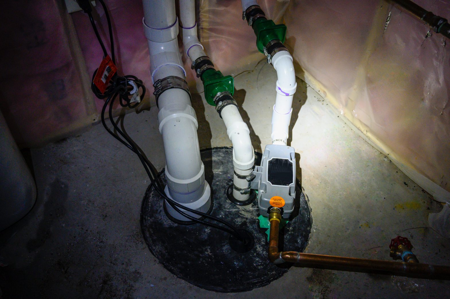 a sump pump in a blackout with a flashlight on it